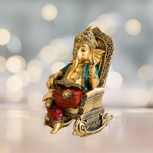Ganesha On Rocking Chair Figurine